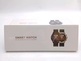 a box with a watch inside of it on a white surface