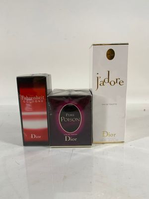 two boxes of perfume sitting next to each other on a white surface