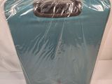 a piece of luggage wrapped in plastic on a white surface