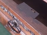 a close up of a wooden drawer with a lock on it