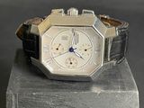 a watch that is sitting on top of a wooden block