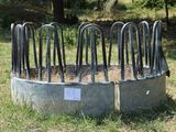 a large metal trough with a bunch of plants inside of it