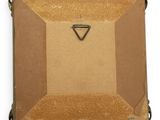 an old suitcase with a triangle on top of it on a white surface