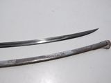 pair of old swords on a white table with a white background