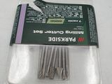 a package of pins in a plastic container on a table