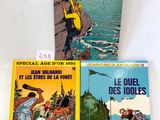 three books on a white surface, one of which is in french and the other of which is in french