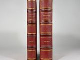 a pair of red books sitting on top of each other