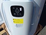 an image of a water heater on a pallet in a parking lot