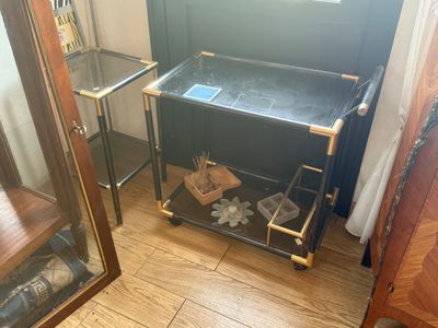 a small table with a glass top in the corner of a room