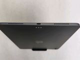 the back of a laptop computer with a small screen on top of it