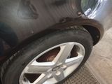 a close up of a car tire on the street