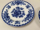 two plates with blue and white designs on them