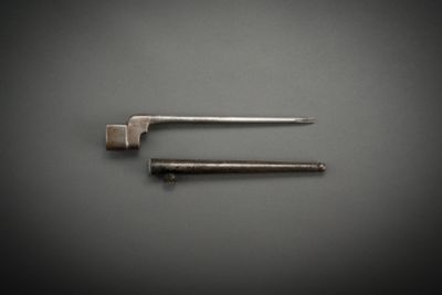 two tools are laying on a table next to each other