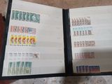 a book with stamps on it sitting on a table