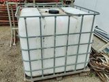 a large container sitting on top of a pallet in the dirt
