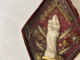 a small box with a picture of a statue on it