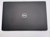 the dell laptop is sitting on a table with a white background