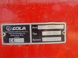 a red fire hydrant with a sticker on it