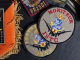 some patches on a table with a bottle of beer