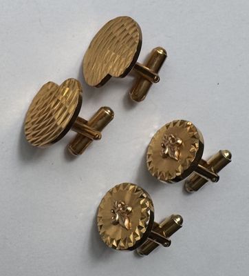 three pairs of gold cufflinks and a pair of gold cufflinks