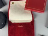 a red case with a book on top of it next to other items