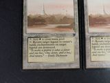 two cards that are sitting on a table