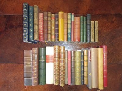 a lot of old books that are on the table