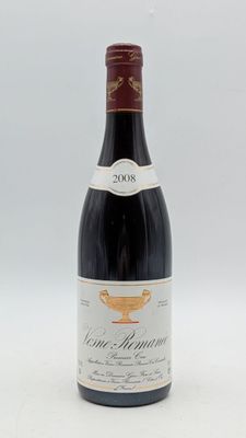 la bouteille de vin est posée sur une surface blanche
