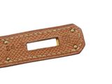 the brown leather belt has a metal buckle on it