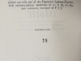 a close up of an open book with writing on it