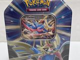 a close up of a pokemon trading card game in a tin