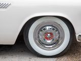 a close up of a white car with chrome rims