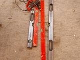 two tools that are laying on the floor next to each other
