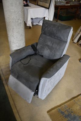 a recliner that is sitting in the middle of a room