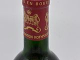 a bottle of wine that is sitting on a table