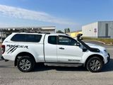 a white truck that is parked in a parking lot