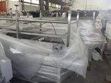 many rolls of plastic on the floor in a warehouse