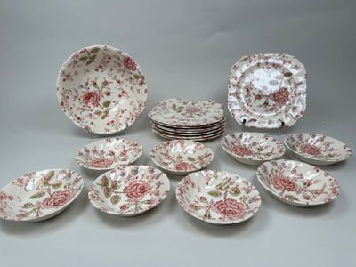 many plates and bowls that are sitting on the table