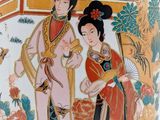 a vase with a picture of a woman and a man on it