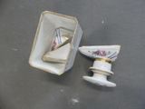 a small white box with a gold trim and a small white box with a gold trim and a small white box with a gold trim and gold trim