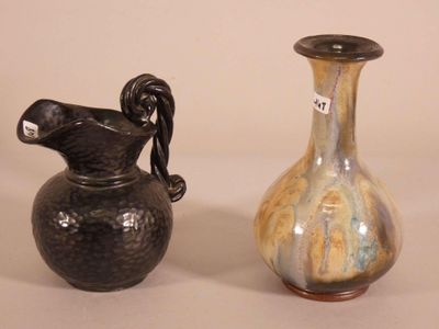 two vases sitting next to each other on a table
