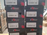 several boxes of power ups on top of a table in a warehouse