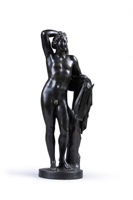 statue of a woman holding a book and a purse