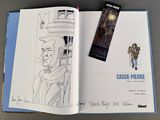 a book with a drawing of a man and a bookmark on it