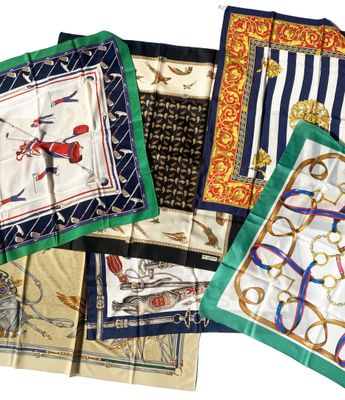 several different types of scarves are laid out on a white surface