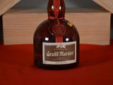 a bottle of grand marnier sitting on a table