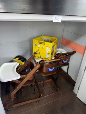 a baby changing table with a box and a chair