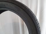 a close up of a tire on a white surface