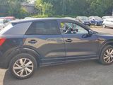a black suv that is parked in a parking lot