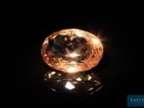 a close up of a diamond on a black surface
